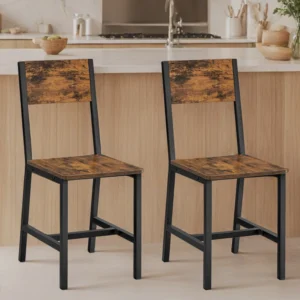 Two industrial-style bar stools with distressed wooden seats and backs facing a kitchen island.