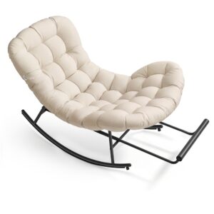 Beige tufted cushioned rocking chair with a black metal frame and curved rockers, designed for lounging.