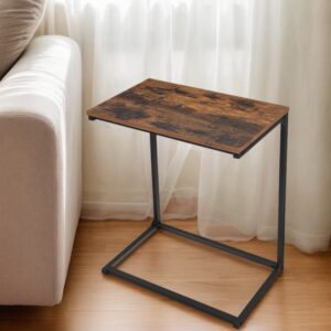 Wooden top side table with a black metal frame beside a beige sofa, near white sheer curtains and a wooden floor